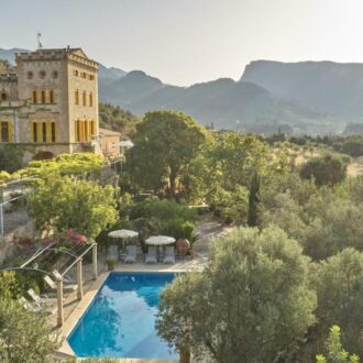 Traditional stone finca surrounded by olive trees in Mallorca.