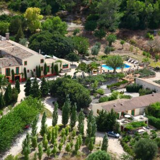 Family enjoying a stay at a rural finca in Mallorca with garden and pool.