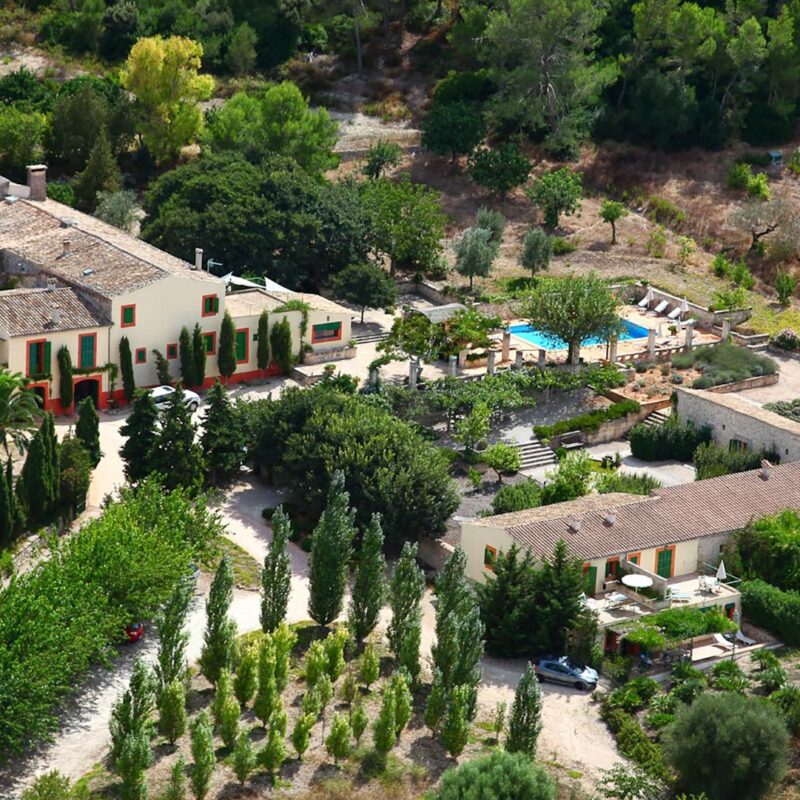 Family enjoying a stay at a rural finca in Mallorca with garden and pool.