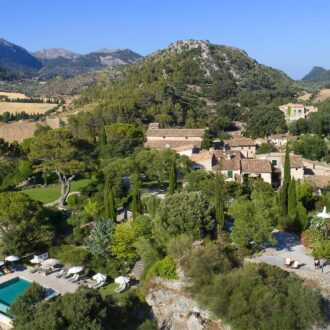 View of Orient Valley with stone houses and Tramuntana mountains.