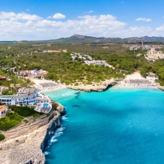 Turquoise cove and sandy beach in Cales de Mallorca on Mallorca’s east coast