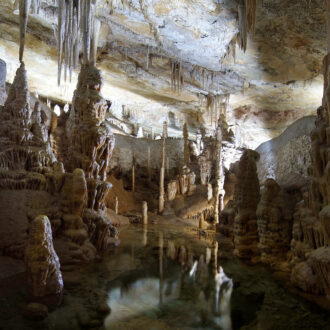 Stalactites reflected in the underground lake inside the Campanet Caves Mallorca