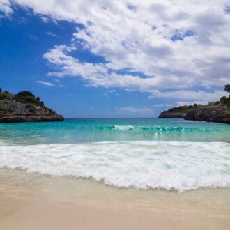 Aerial view of Cala Anguila with turquoise water on Mallorca’s east coast.