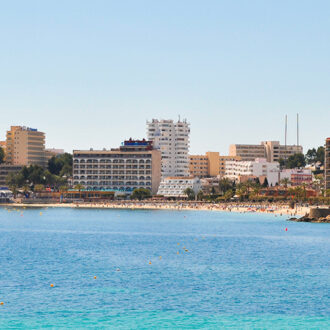 Wide golden sand and calm turquoise water on Palmanova’s main beach, Platja de Na Nadala